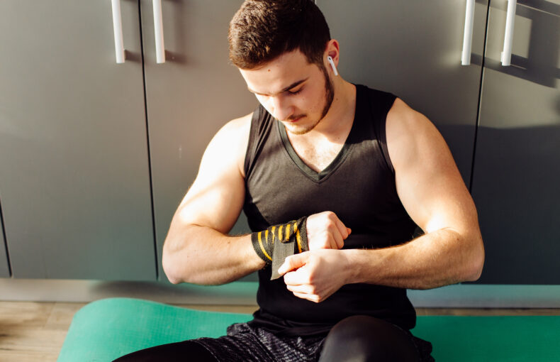 Young Man Doing Workout Exercises at Home for Fitness Training